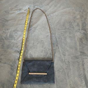 Denim look cross body bag with silver accents. Mossimo. Purse 9 1/2” by 7”.